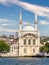 View from Bosphorus Strait overlooking Ortakoy Mosque, or Ortakoy Camii, suited at Ortakoy pier square, Istanbul, Turkey