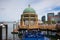 View of Boston from harbor and rowes wharf at sunset