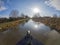 View from bow of narrowboat on a British canal in rural setting