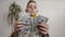 View of boy Counting Many American 100 bills. The little boy counts the American currency. White background, indoor