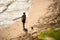 View of a boy at Paciencia beach in Salvador having fun and sunbathing