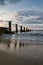 View of breakwaters in the wavy sea at sunset, Isle of Wight, England