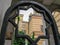 View of the brick building of a large synagogue through an old patterned fence. Budapest. Hungary