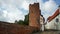 View of the brick wall and Halbturm-Haus, a half-timbered house at the street An der Mauer, beautiful architecture, Lubeck,