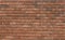 VIEW OF A BRICK WALL ON THE SIDE OF A BUILDING
