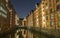 View of the bridge and the brick building in Hamburg, night illumination