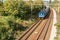 View from the bridge on a moving passenger train on the Tisnov - Brno line in the Czech Republic. Rail transport. Ecological