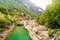 View from Bridge Ponte dei Salti to Verzasca River at Lavertezzo - clear and turquoise water stream and rocks in Ticino - Valle