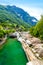 View from Bridge Ponte dei Salti to Verzasca River at Lavertezzo - clear and turquoise water stream and rocks in Ticino - Valle