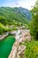 View from Bridge Ponte dei Salti to Verzasca River at Lavertezzo - clear and turquoise water stream and rocks in Ticino - Valle