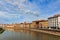 View from the bridge Ponte di Mezzo to the Lungarnos the streets along the bank of the Arno river through Pisa, Tuscany, Italy