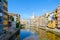 View of bridge of St. Augustine across river Onyar, Cathedral and buildings of city Girona, Spain