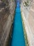 View from the bridge to the boats and yachts passing through the Corinth Canal from a sunny day on Peloponnese in Greece