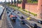 View from the bridge to the Kremlin wall, Kremlin waterfront with traffic, Moscow, Russia.