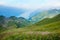 View from Brienzer Rothorn mountain to lake Brienzersee, green hills with flowers, switzerland