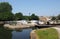 view of brighouse basin with boats and moorings and the lock gates to the calder and hebble navigation canal in west