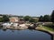 View of brighouse basin with boats and moorings and the lock gates to the calder and hebble navigation canal in west