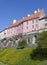 View of bright houses on Toompea hill from Toompark in Tallinn. Dandelions at walls