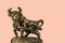 View of bronze figure of Taurus cattle sign isolated on pink  background