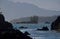 View of Brookes Peninsula with rocky shore and small islands in foreground