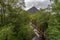 View Buachaille Etive Mor between trees in Glencoe, Highlands, Scotland, England