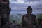 View of Buddha statue on a misty morning at Borobudur Temple