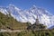 View of a Buddhist stupa with mountain Lhotse and Ama Dablam behind on the way from Namche Bazaar to Tengboche.