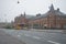 View of the building of the railway station foggy November day. Copenhagen