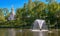 View of the building Special pantry from the Sand Pond. In the center of the pond there is a fountain. Petergof. Russia.