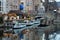 View of buildings and boats by waterway n Bruges