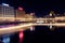 View of the buildings by the water and the river in Geneva at night