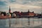 view of buildings at waterfront against cloudy sky in Stockholm