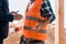 View of businessman holding walkie talkie near constructor