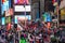 View of busy Times Square including the iconic Ruby Red Stairs