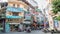 View of busy traffic with motorbikes and vehicles in Hanoi Old Quarter, capital of Vietnam. People can seen exploring around it.