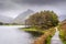 A view of Buttermere Lake with mount Fleetwith Pike in the background