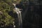 VIEW OF CABLES AND ANCHOR CABLES OVER PART OF ORIBI GORGE WITH WATERFALL