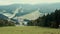 A view of the Cableway Chairlift or funicular along the forest of mountain landscape autumn. Cloudy day.