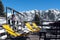 View of the cafe outdoor terrace on the ski slope with orange loungers on it