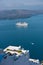 View from Caldera cliff at cruisers and volcanic island, Fira, Santorini