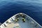 View on calm blue Mediterranean Sea and mooring station with yellow bollards from top of mast.