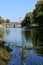 View of the calm current and the banks of the Polist River, Bridge and the old water tower in the ancient city of Staraya Russa.