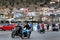 A view of Calymnos Island`s houses on the hill and motorbike riders in front in city