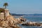 View of Cami Ronda de S'Agaro a Sa Conca S'Agaro with rocks on the beach in Spain