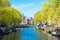 View of a canal in Amsterdam, quiet urban scene of the city center.