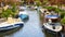 View on canal with boat and motorboat water. Picturesque landscape. Icmeler in Turkey.