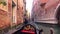 View of the Canal in Venice, Italy. Gondolas at the views background of Venice.