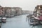 View of the Canal in Venice from Rialto bridge,gondolas are crossing the river and people enjoy their winter vacations