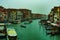 View of the Canal in Venice from Rialto bridge,gondolas are crossing the river and people enjoy their winter vacations