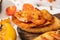 View of canape with toast bread and fried shrimps on wooden board